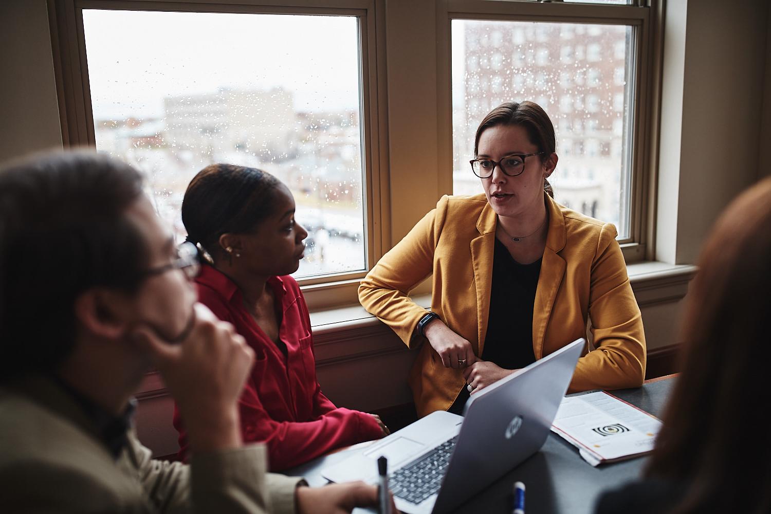 graduate students discussing in a small group