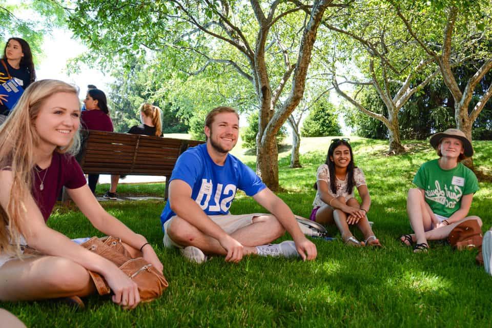 Students sitting together in the shade