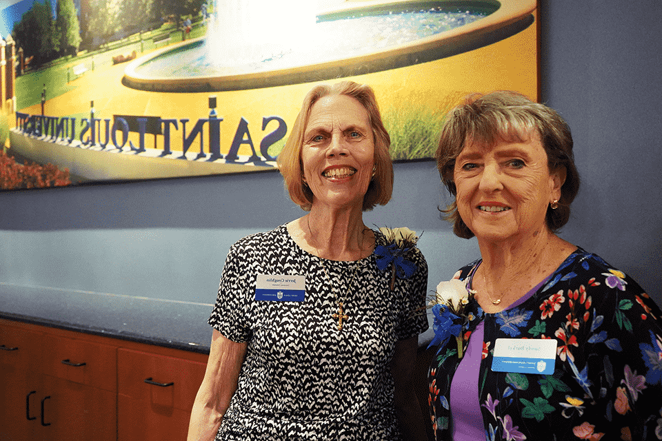 Two women pose for a photo together.