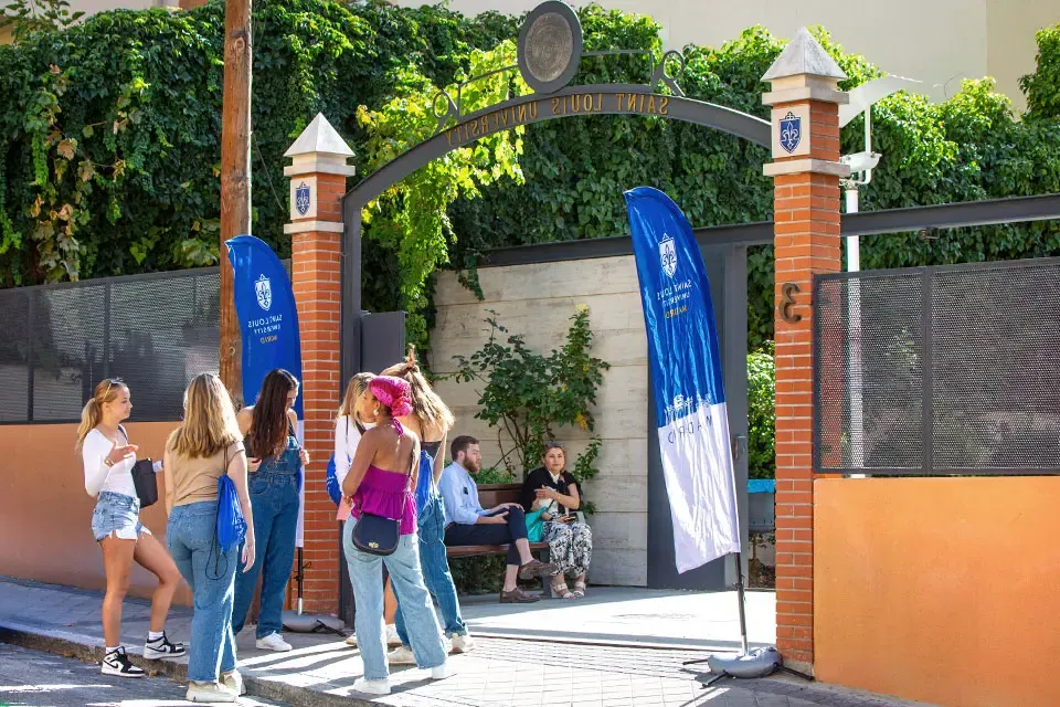 Students talking at San Ignacio Hall entrance.