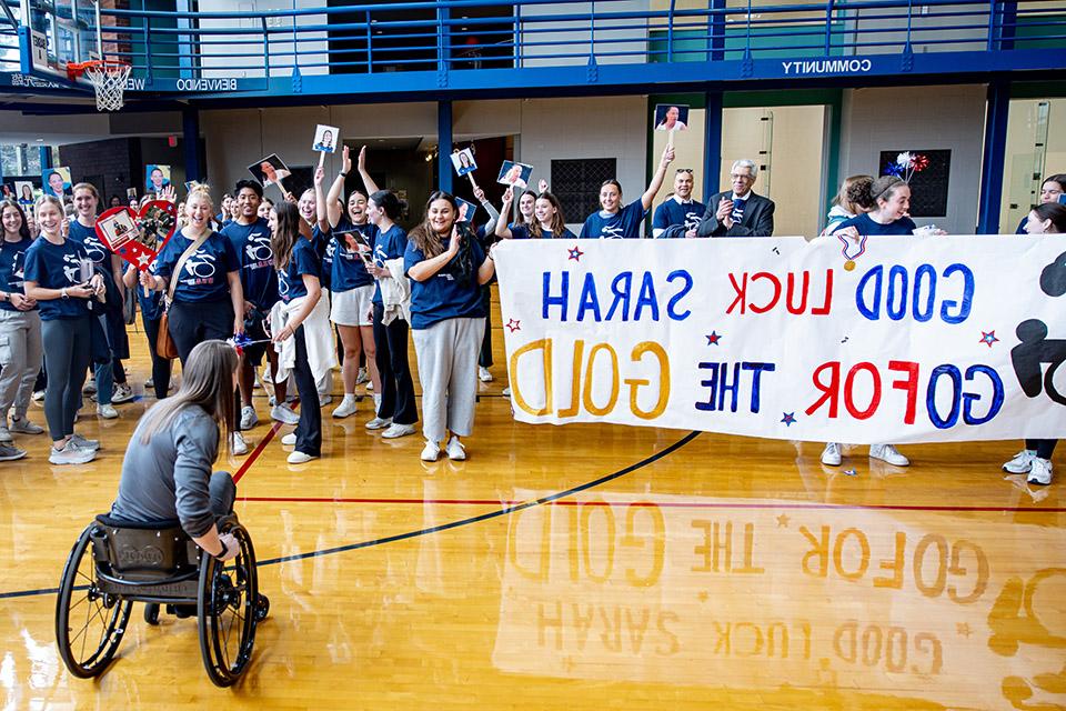 A group of people celebrate Sarah Adam.